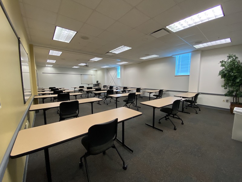 Meeting Room 215/216 with 15 individual tables with a chair