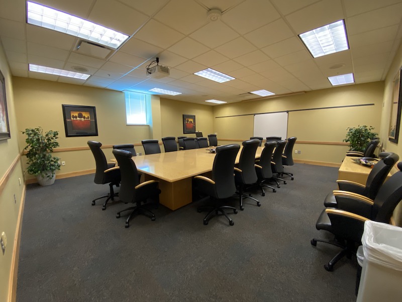 Meeting Room 211 with chairs around a large conference table